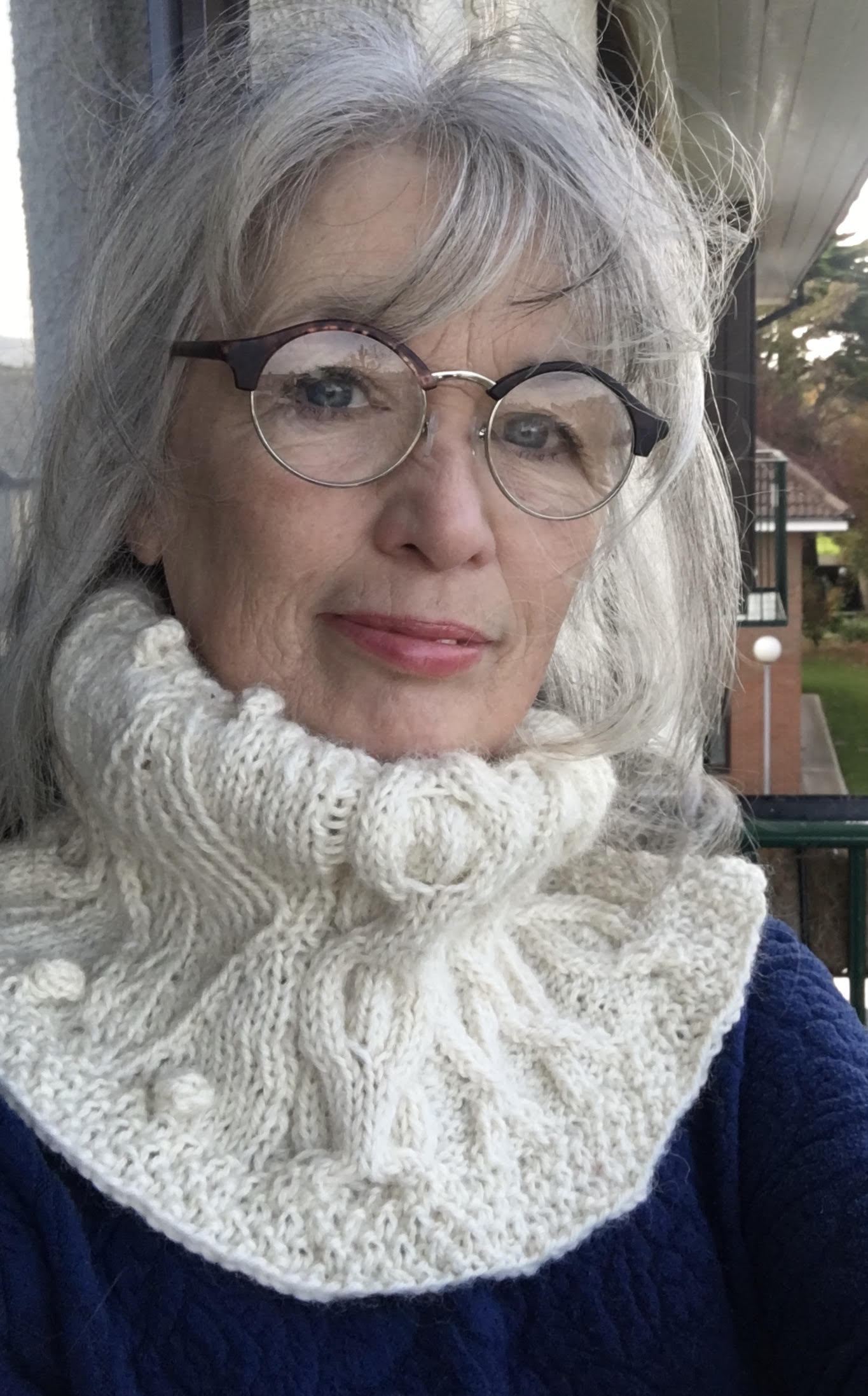 Woman wearing knitted cowl