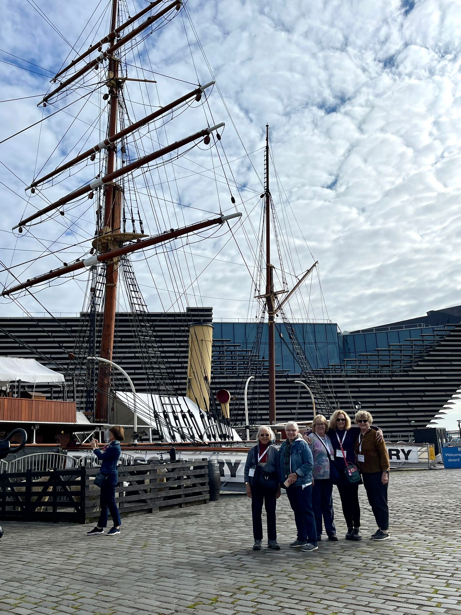 Group in front of historic ship