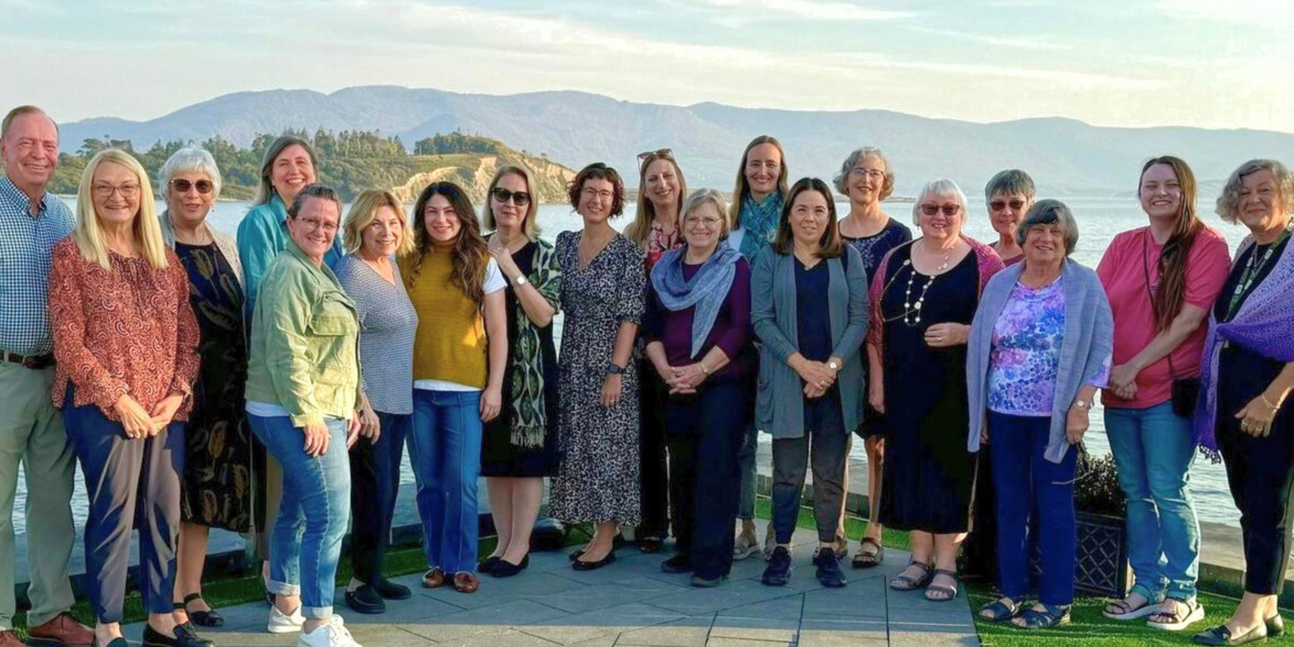 Group photo with lake in background
