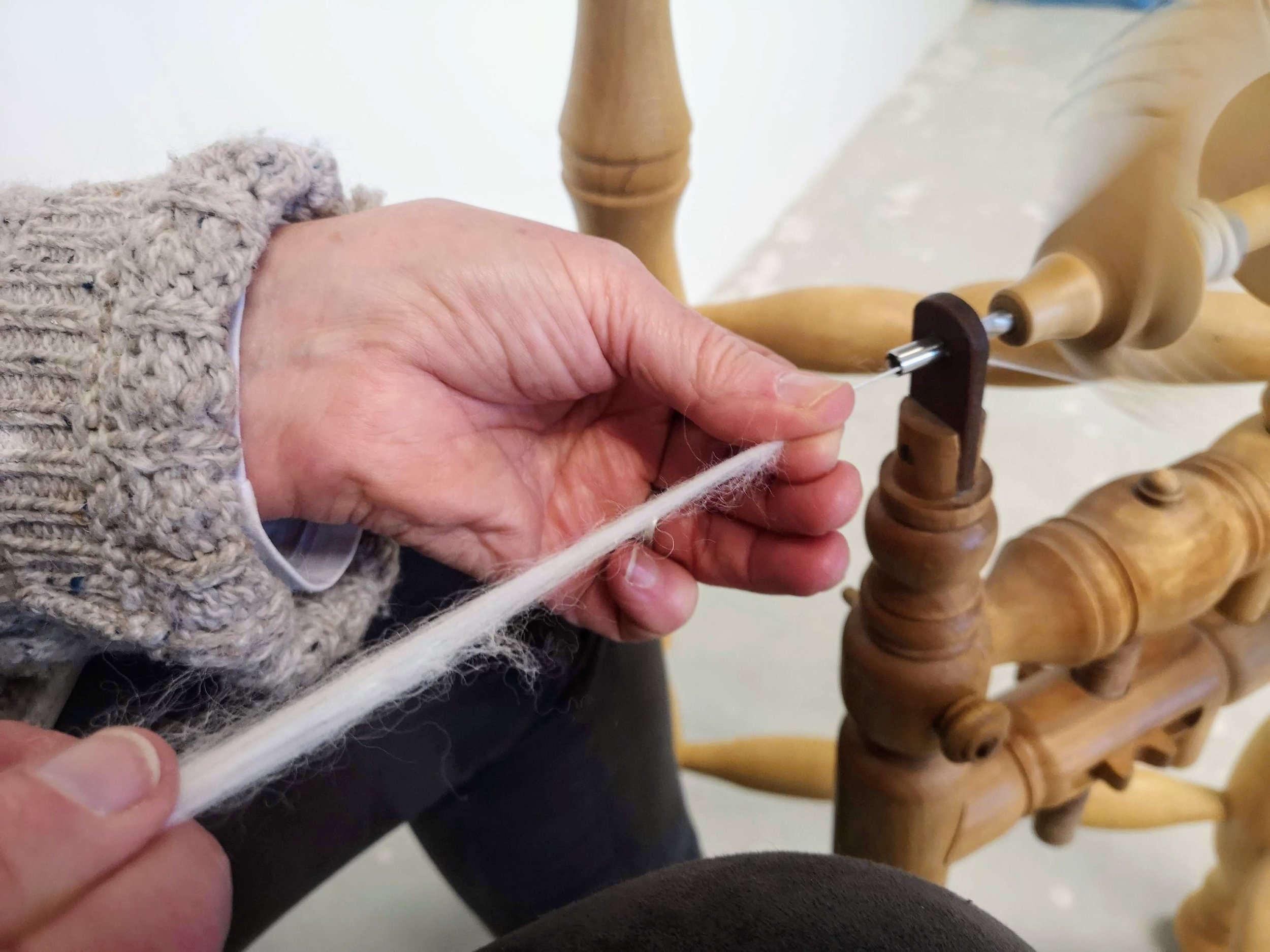 Woman's hand spinning wool
