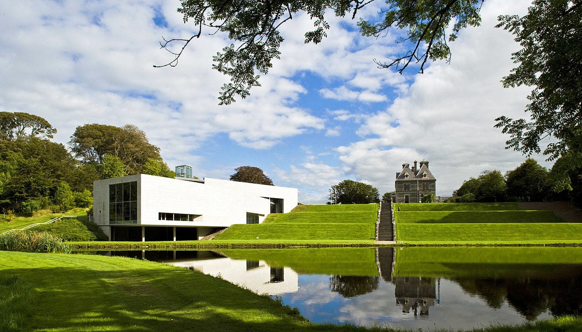 Building with landscape and lake