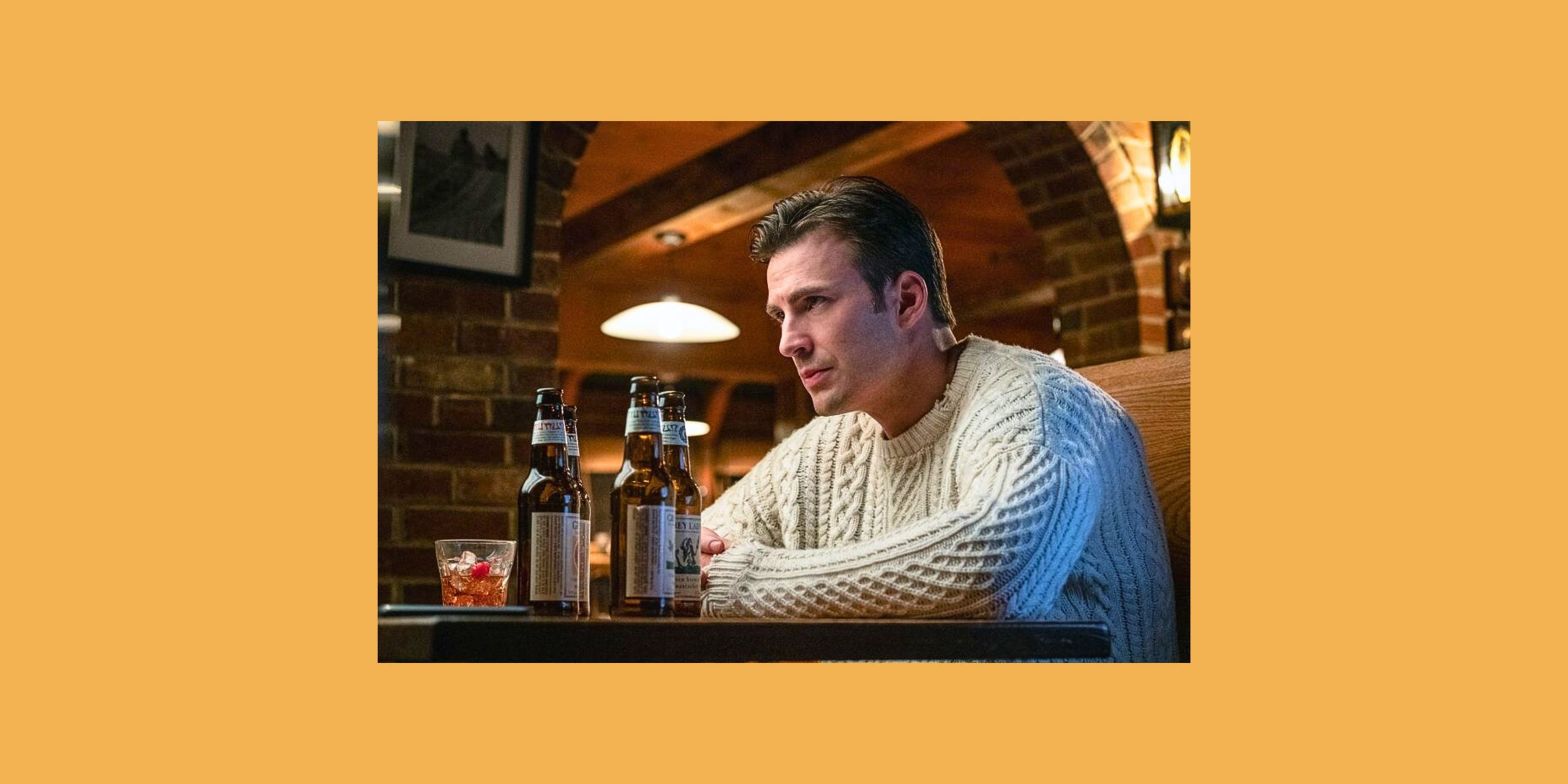 Chris Evans wearing a white jumper