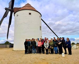 Group in front of windmill