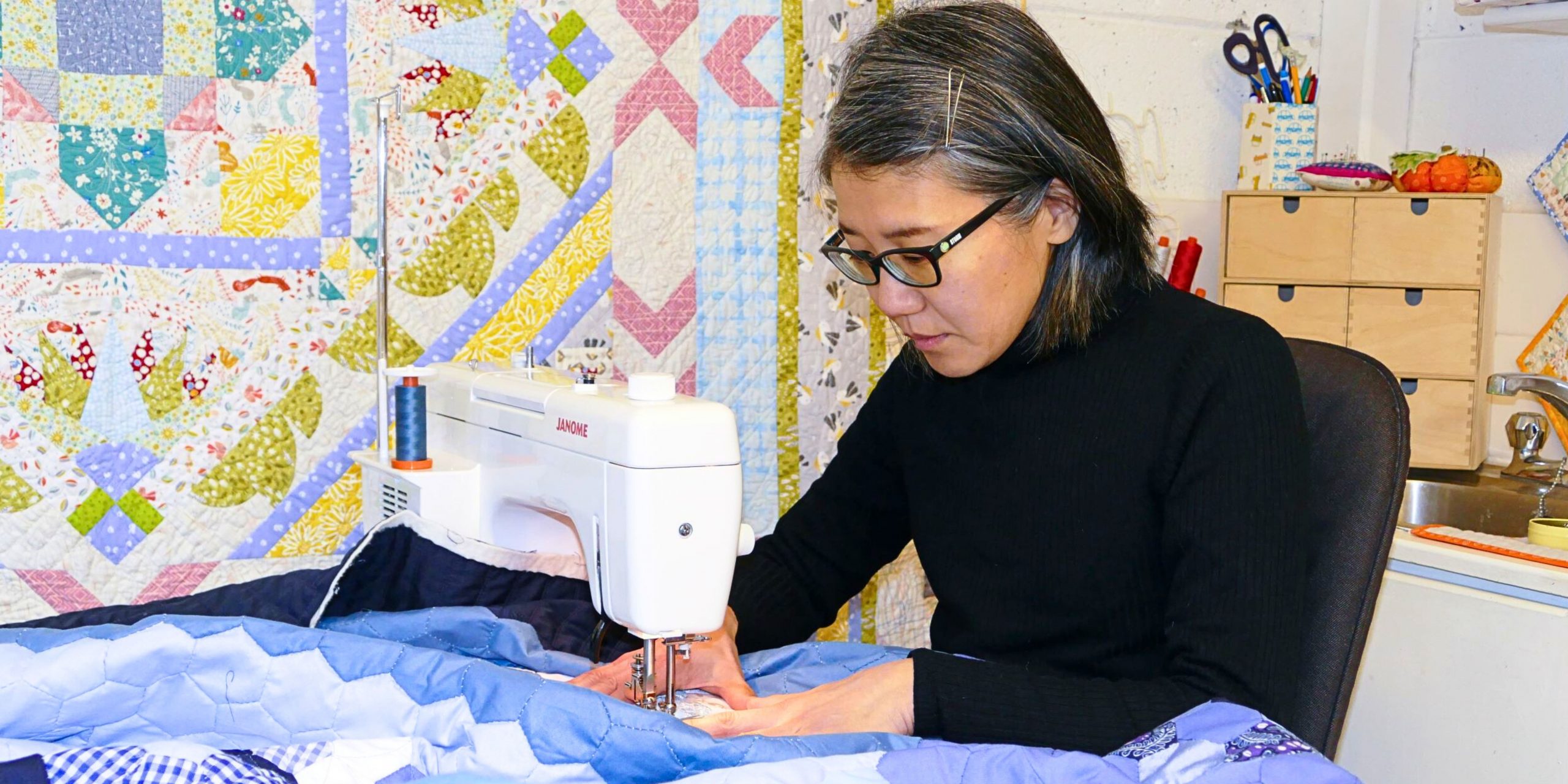 Tomomi working with a sewing machine