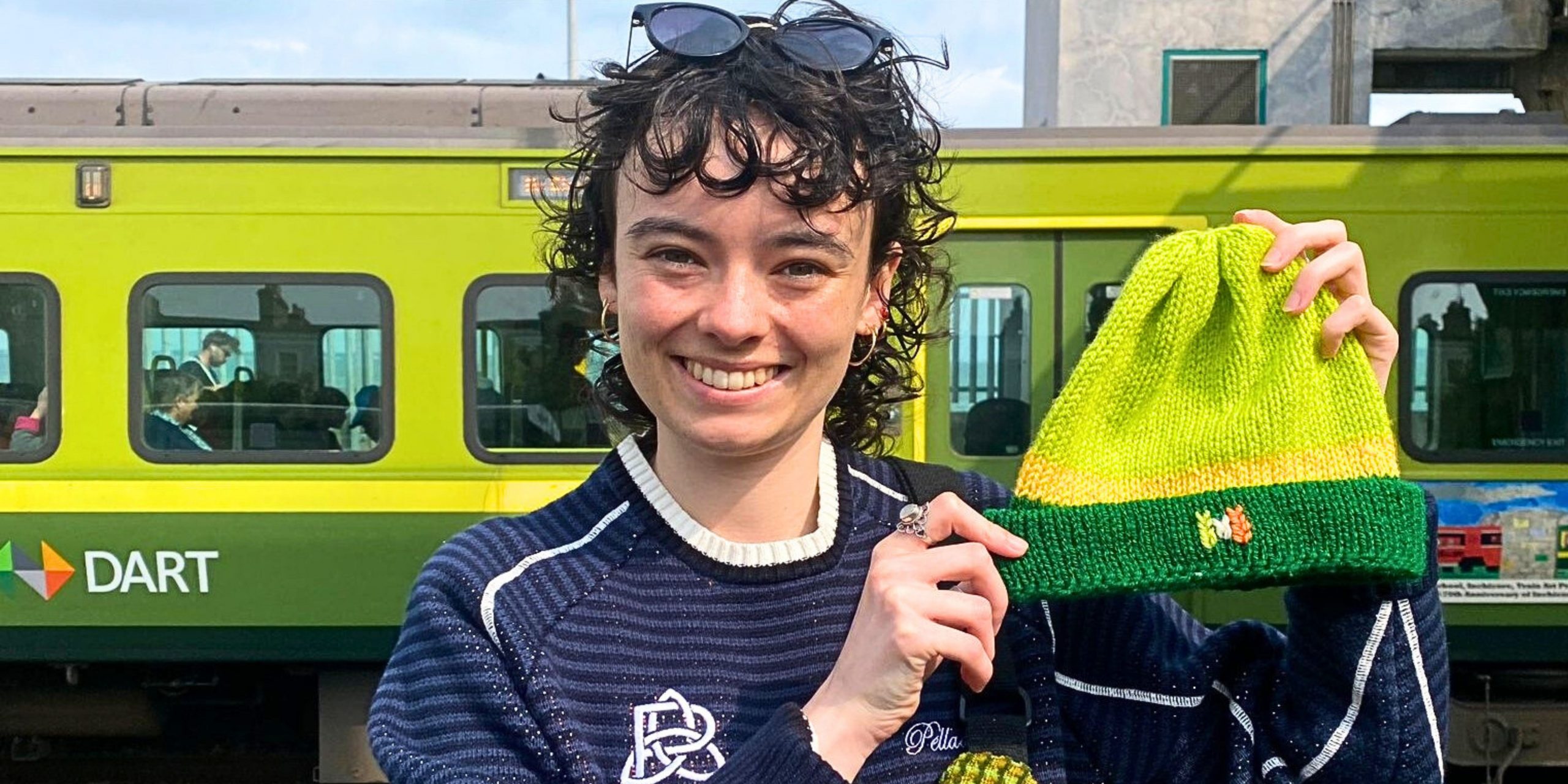 Siobhan holding a handmade hat
