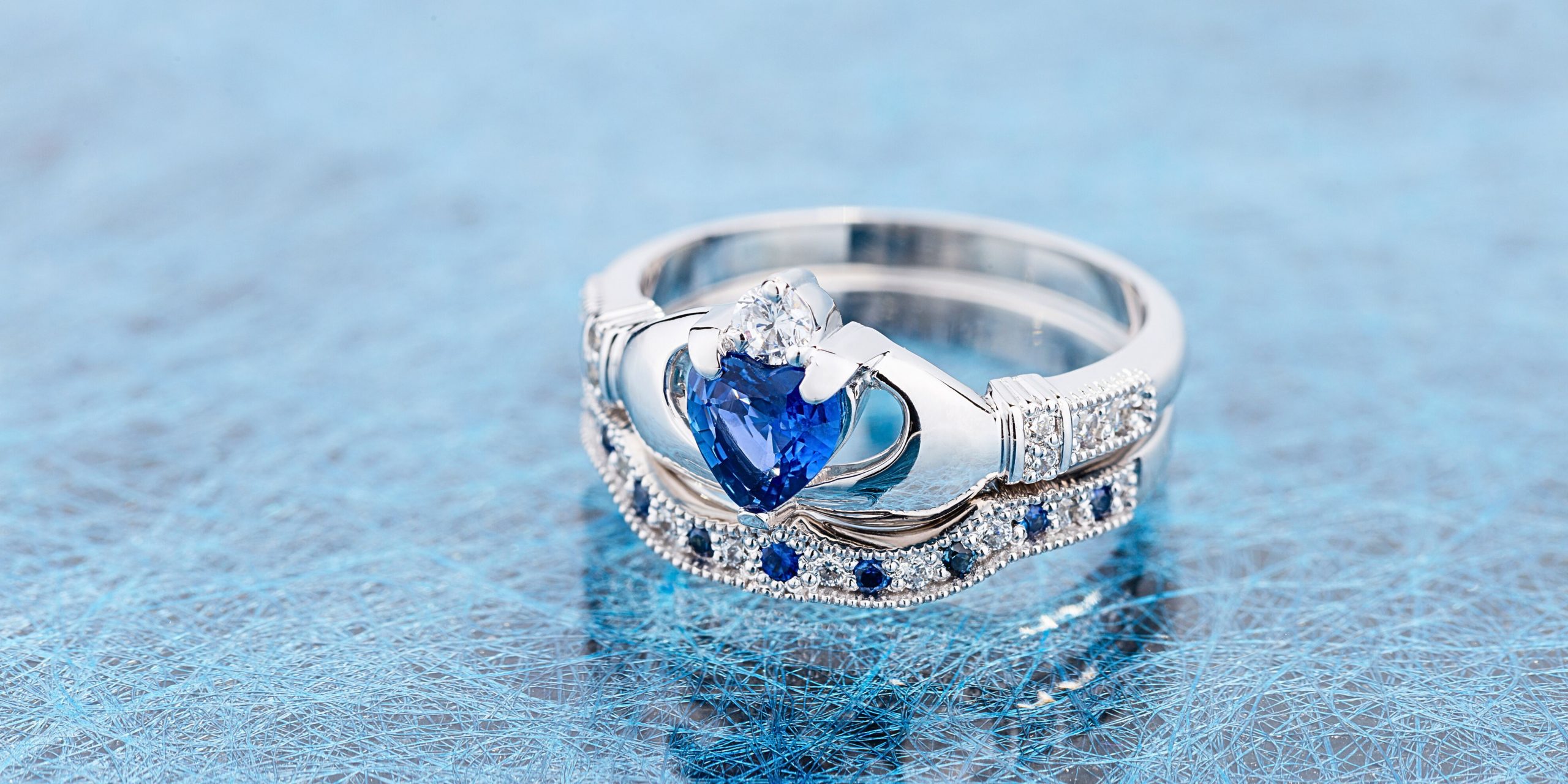 Silver claddagh ring with blue centre