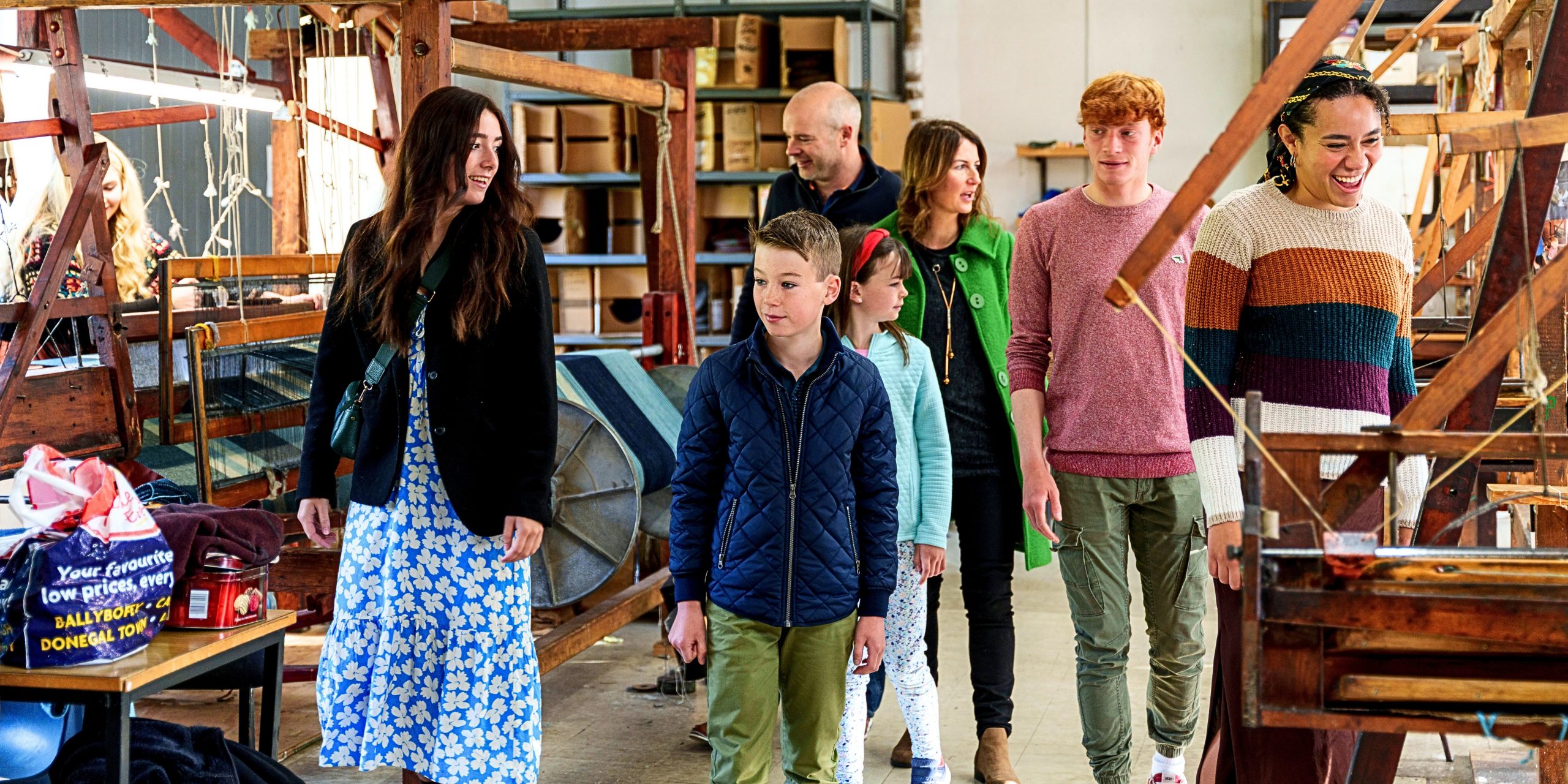 Family walking through the colourful studio