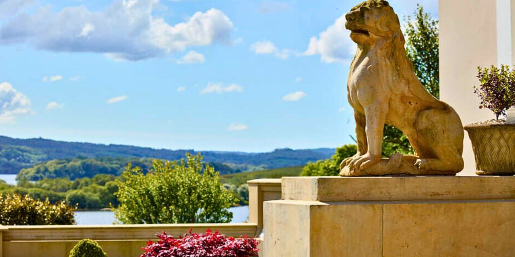Lion statue, gardens and lake in the distance