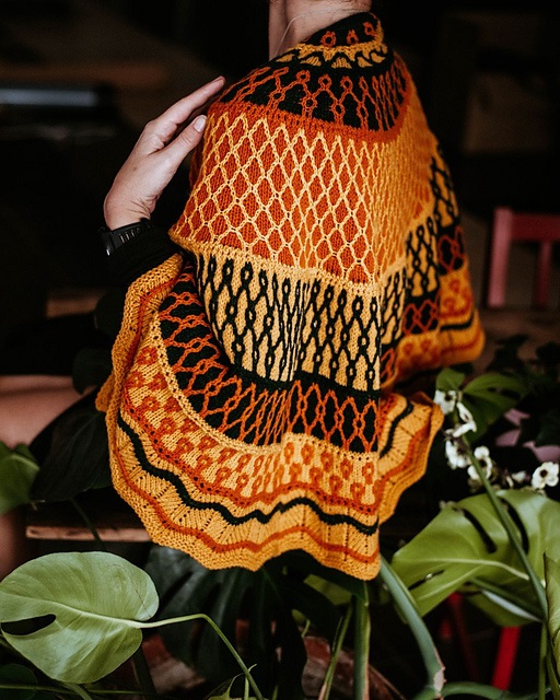 Colourful shawl surrounded by foliage