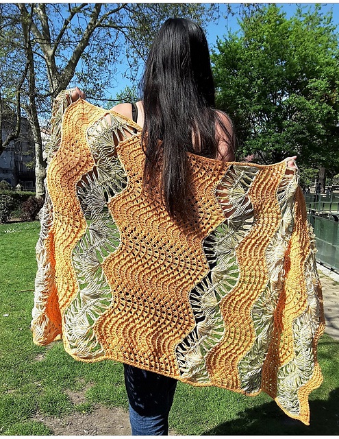 Shawl over woman's back in a garden